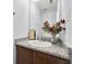 Bathroom featuring granite countertops, vanity, and a decorative mirror at 3682 Harvest Dr, Decatur, GA 30034