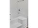 Bathroom featuring a deep soaking tub with a tiled surround and chrome fixtures for relaxation at 3682 Harvest Dr, Decatur, GA 30034