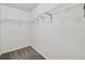 A walk-in closet features built in shelving with carpeted floors at 3682 Harvest Dr, Decatur, GA 30034