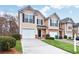 Inviting townhome features a well-manicured lawn, a one-car garage, and a charming front entrance at 3682 Harvest Dr, Decatur, GA 30034