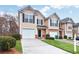 Inviting townhome boasting a single-car garage and a beautifully landscaped yard with neutral siding at 3682 Harvest Dr, Decatur, GA 30034