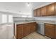 Well-equipped kitchen features granite countertops and stainless steel dishwasher and a view to the living space at 3682 Harvest Dr, Decatur, GA 30034