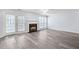 Living room with hardwood flooring, fireplace, and double doors at 3682 Harvest Dr, Decatur, GA 30034