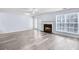 Bright living room with a cozy fireplace, and stylish gray laminate flooring at 3682 Harvest Dr, Decatur, GA 30034