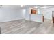 Open-concept room showcases the wood-look floors extending from the living area to the kitchen area at 3682 Harvest Dr, Decatur, GA 30034