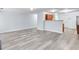 Open-concept living area with gray flooring and a view of the kitchen at 3682 Harvest Dr, Decatur, GA 30034