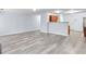 Open-concept living room with neutral walls and modern, light-colored flooring at 3682 Harvest Dr, Decatur, GA 30034
