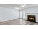 Bright living room with a fireplace, French doors, and modern gray flooring at 3682 Harvest Dr, Decatur, GA 30034