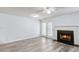 Bright living room features a fireplace, ceiling fan, and access to an outdoor space at 3682 Harvest Dr, Decatur, GA 30034