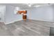Spacious living room with wood-look floors leading to the kitchen at 3682 Harvest Dr, Decatur, GA 30034