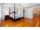 Bedroom featuring trey ceiling, four poster bed, and natural light at 720 First Cotton Dr, Powder Springs, GA 30127