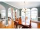 Formal dining room featuring an elegant chandelier, and hardwood floors at 720 First Cotton Dr, Powder Springs, GA 30127