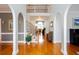 Grand foyer with soaring ceilings, staircase, and hardwood floors creating an inviting entrance at 720 First Cotton Dr, Powder Springs, GA 30127