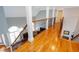 Hallway with wood flooring and wooden banister at 720 First Cotton Dr, Powder Springs, GA 30127