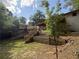 The backyard features a wooden deck and staircase leading to a retaining wall at 1759 Wilmont Ne Dr, Atlanta, GA 30329