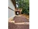 The backyard features a wooden deck, ground cover, and a retaining wall at 1759 Wilmont Ne Dr, Atlanta, GA 30329