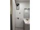 Bathroom featuring a vanity with gray cabinets, mirror, and laundry connections at 1759 Wilmont Ne Dr, Atlanta, GA 30329
