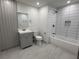 Modern bathroom featuring a vanity with gray cabinets, tile flooring, and tub with shower at 1759 Wilmont Ne Dr, Atlanta, GA 30329