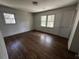 Bright bedroom featuring hardwood floors, fresh paint, and natural light from two large windows at 1759 Wilmont Ne Dr, Atlanta, GA 30329