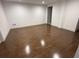 A large room features gleaming hardwood floors, white walls, and a doorway at 1759 Wilmont Ne Dr, Atlanta, GA 30329