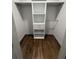 Walk-in closet with custom shelving units providing ample storage and organization solutions at 1759 Wilmont Ne Dr, Atlanta, GA 30329