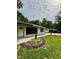 Charming brick home with manicured landscaping, walkway, and an attached garage at 1759 Wilmont Ne Dr, Atlanta, GA 30329