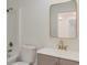 Clean bathroom featuring a modern vanity, gold faucet, and a combination shower and tub at 235 Dodd Sw Ave, Atlanta, GA 30315