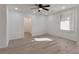A bright bedroom features a large window and hardwood floors, with a view into another room at 235 Dodd Sw Ave, Atlanta, GA 30315