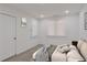 Bright bedroom featuring a double window and recessed lighting, and a bed with a grey throw blanket at 235 Dodd Sw Ave, Atlanta, GA 30315