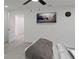 Bright bedroom featuring a ceiling fan, a wall-mounted TV, and light wood flooring at 235 Dodd Sw Ave, Atlanta, GA 30315