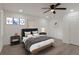 Bright bedroom with a queen bed, wood floors, recessed lights, ceiling fan and minimalist modern decor at 235 Dodd Sw Ave, Atlanta, GA 30315