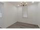 A bright dining room with hardwood floors, a modern light fixture, and a large window at 235 Dodd Sw Ave, Atlanta, GA 30315
