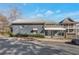 Quaint gray home featuring a covered front porch, mature shrubs, and a well-maintained facade on a sunny day at 235 Dodd Sw Ave, Atlanta, GA 30315