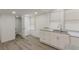 Kitchen featuring granite counters, white cabinetry and stainless steel sink at 235 Dodd Sw Ave, Atlanta, GA 30315