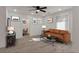 Bright living room features light wood flooring, a ceiling fan, and a comfortable sofa, illuminated by natural light at 235 Dodd Sw Ave, Atlanta, GA 30315