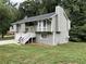 A two-story home featuring a chimney and well-maintained lawn at 2961 Forelock Sw Pl, Marietta, GA 30064