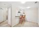 Basement bar area features a serving area, white walls, neutral carpeting, and bar stool seating at 3915 Northridge Dr, Cumming, GA 30040