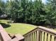View from wooden deck showing lawn and landscaping with mature trees at 2741 Willowstone Dr, Duluth, GA 30096