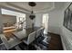 Elegant dining room with hardwood floors, a large table, and decorative lighting at 2741 Willowstone Dr, Duluth, GA 30096