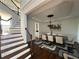 Elegant dining room with hardwood floors, a large table, and staircase at 2741 Willowstone Dr, Duluth, GA 30096