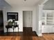 Bright entryway featuring hardwood floors, built-in shelving, and fresh white trim at 2741 Willowstone Dr, Duluth, GA 30096