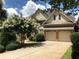 Traditional two-story brick home featuring a two-car garage and beautifully landscaped front yard at 2741 Willowstone Dr, Duluth, GA 30096