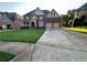 Charming two-story home featuring a manicured lawn, stone accents, and a two-car garage at 2741 Willowstone Dr, Duluth, GA 30096