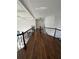 Second story hallway with beautiful hardwood flooring and banister at 2741 Willowstone Dr, Duluth, GA 30096