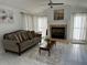 Cozy living room with a fireplace, neutral paint and plenty of natural light at 2741 Willowstone Dr, Duluth, GA 30096