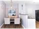 Cozy dining area featuring modern lighting fixture, neutral walls, and a sliding glass door at 2763 Snapfinger Mnr, Decatur, GA 30035