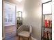 Bright hallway featuring a comfy chair, lamps, and view into a bedroom at 2763 Snapfinger Mnr, Decatur, GA 30035