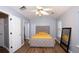 Serene bedroom featuring a ceiling fan, neutral tones, and a full length mirror at 2763 Snapfinger Mnr, Decatur, GA 30035
