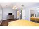 Spacious main bedroom with a ceiling fan, large closet, and view into the bathroom at 2763 Snapfinger Mnr, Decatur, GA 30035