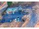 Overhead view of community pool with ample parking and a clubhouse, adding to neighborhood's amenities at 513 Mirramont Pl, Woodstock, GA 30189